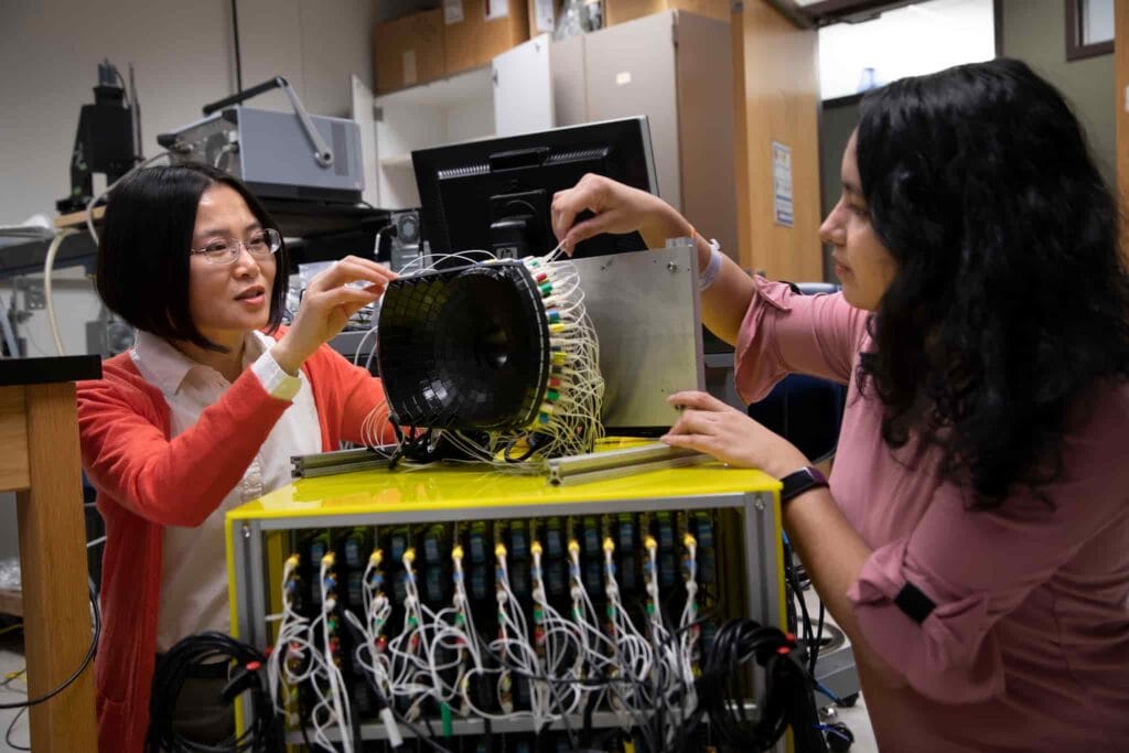 Zhen Xu and her student working on a histotripsy device